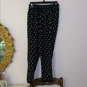 Black pants with pink flowers on them